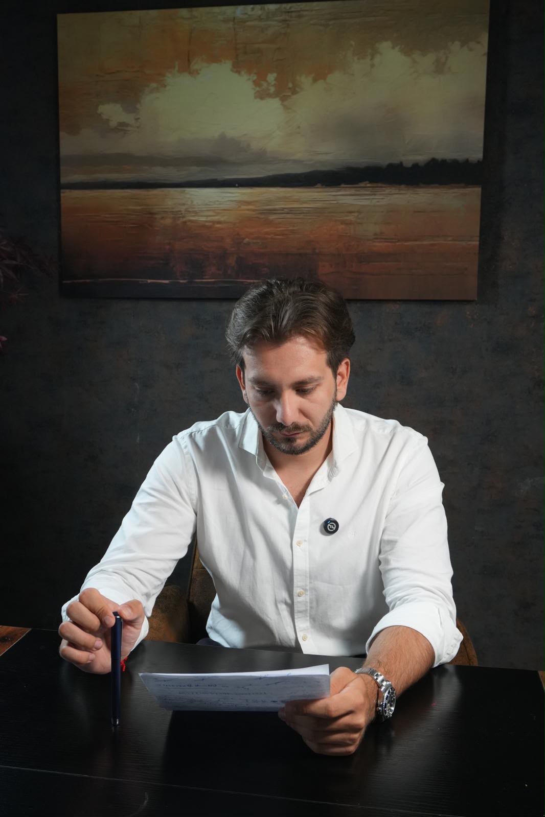 Alberto García López reviewing a case file at the firm's office in Fuengirola